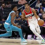 Oct 12, 2023; Washington, District of Columbia, USA; Washington Wizards guard Jordan Poole (13) drives to the basket as Charlotte Hornets guard Frank Ntilikina (44) defends in the third quarter at Capital One Arena. Mandatory Credit: Geoff Burke-USA TODAY Sports