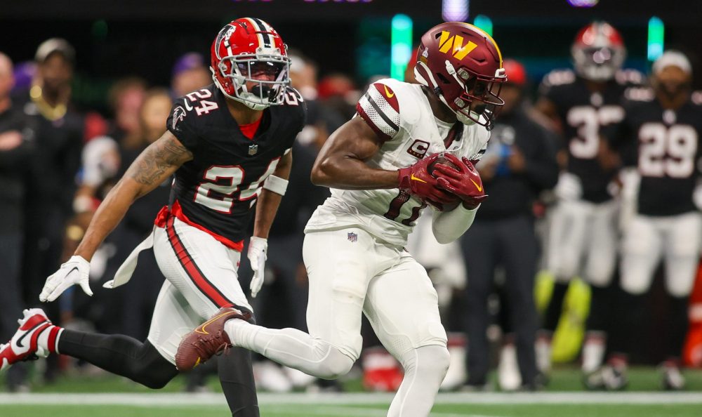 Washington Commanders wide receiver Terry McLaurin (17) catches a pass in front of Atlanta Falcons cornerback A.J. Terrell (24) during an NFL game at Mercedes-Benz Stadium in Atlanta, Georgia.