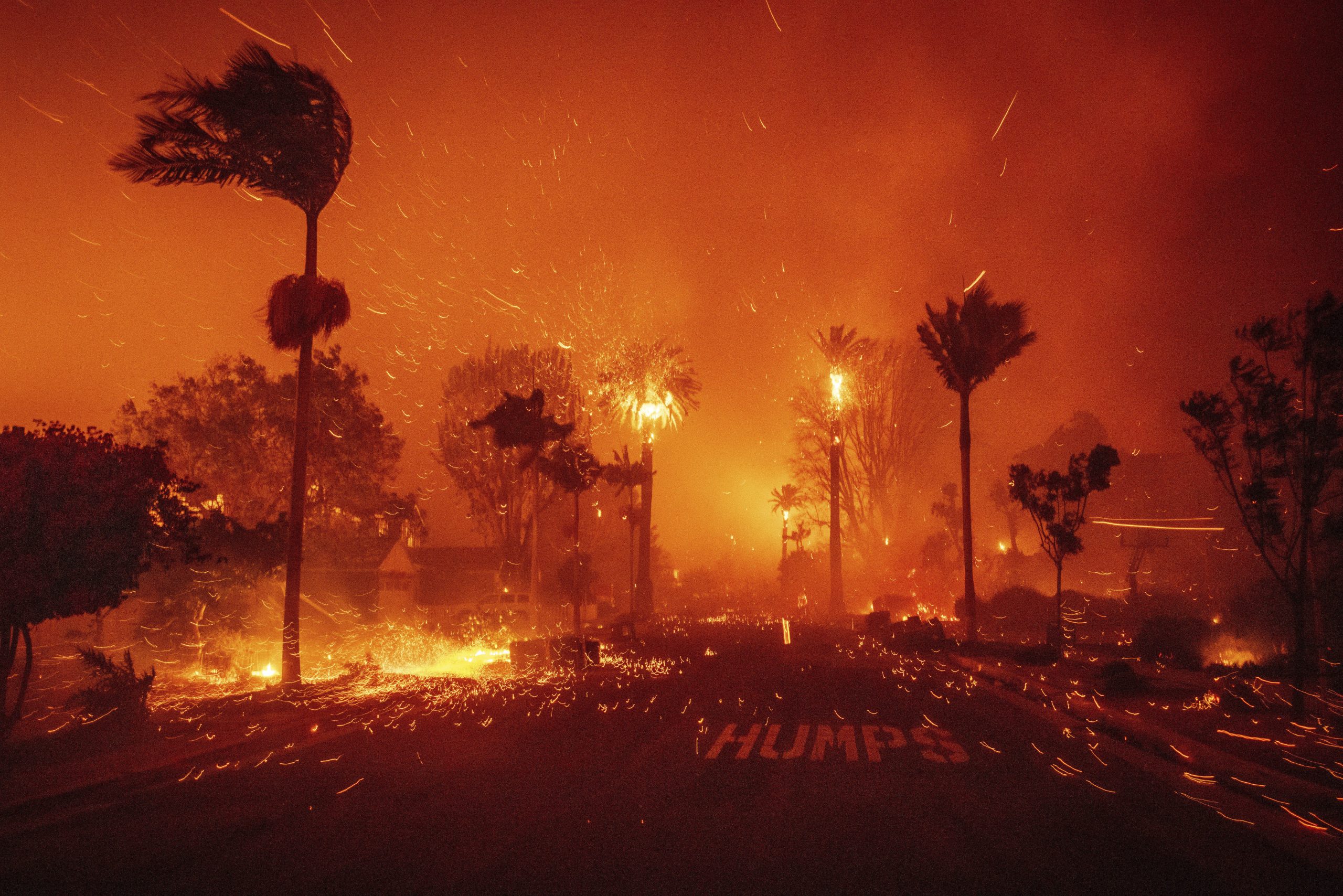 The Palisades Fire ravages a neighborhood amid high winds