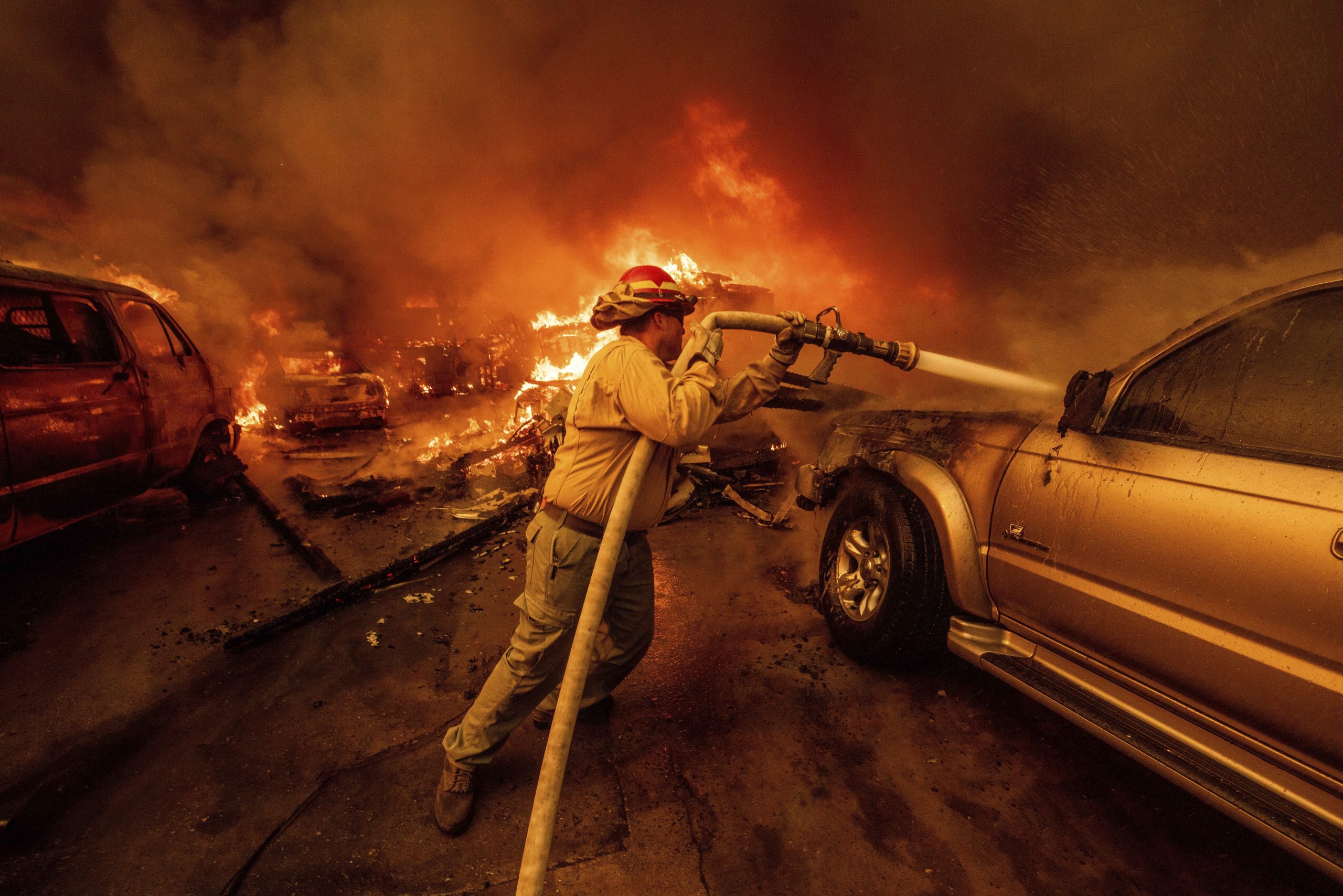 A firefighter battles the Eaton Fire Wednesday, Jan. 8, 2025...