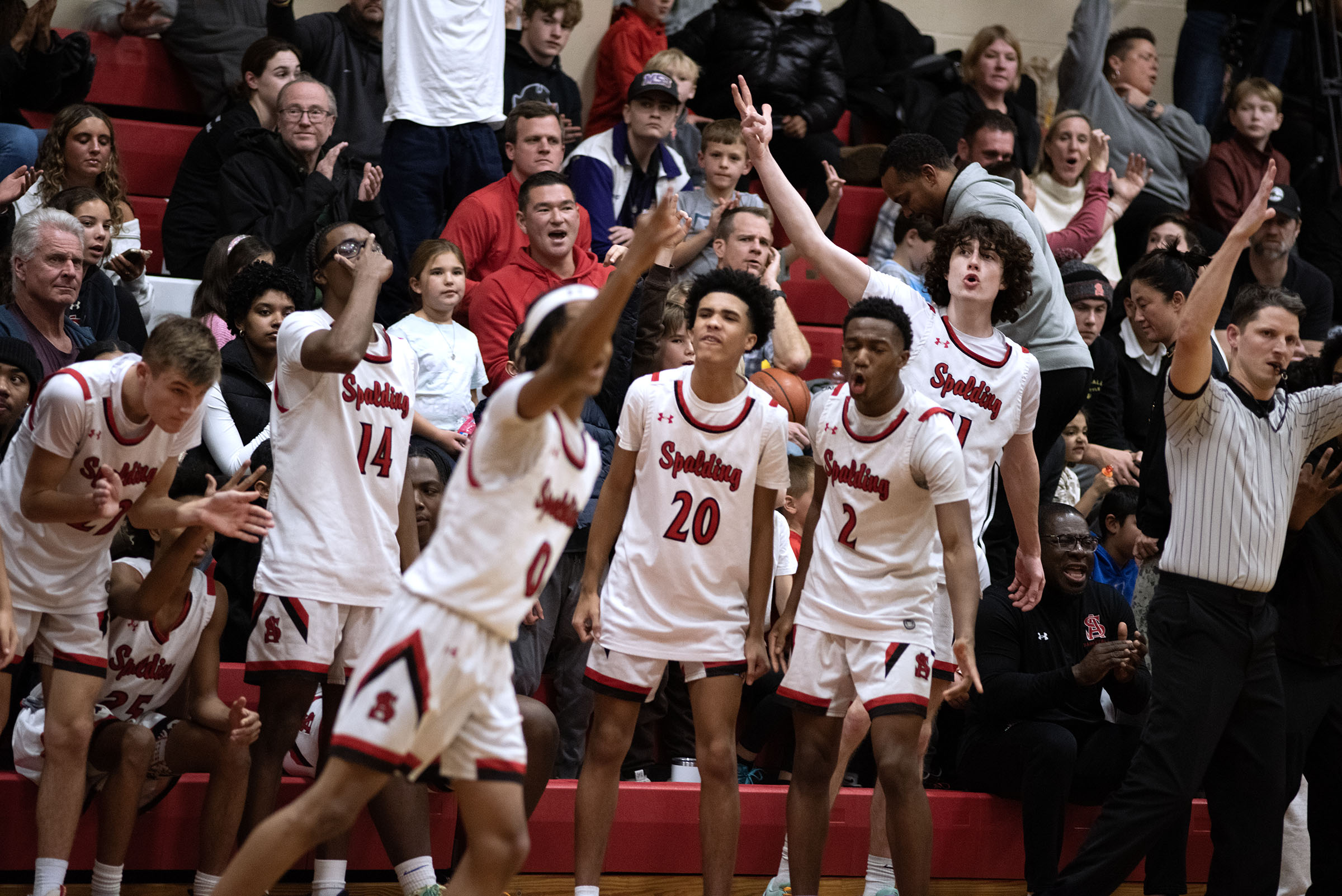 Jan. 3, 2025- Spalding’s bench reacts after a three-pointer by...