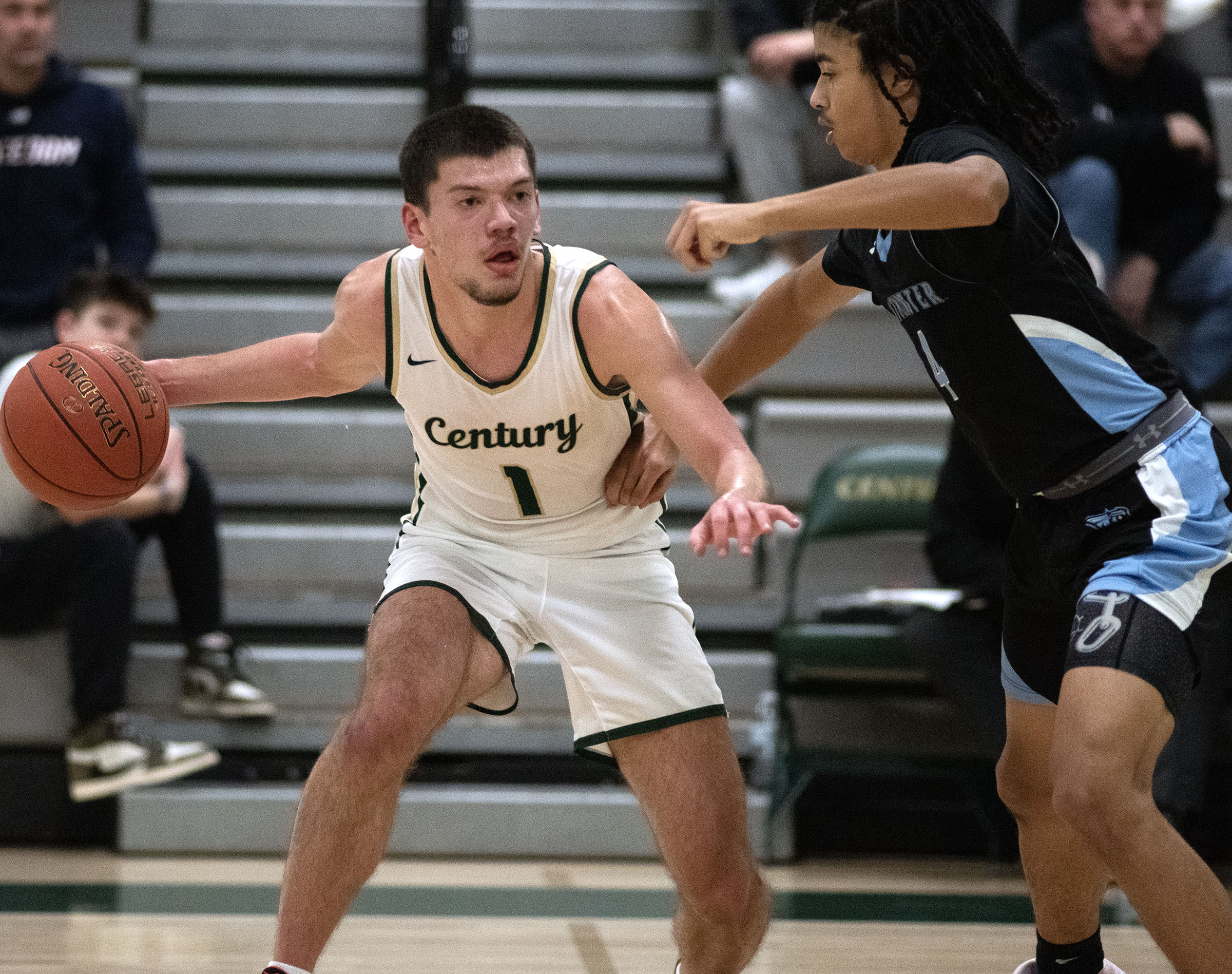 Century's Nick Baron tries to work around Westminster's Paul Burgee...