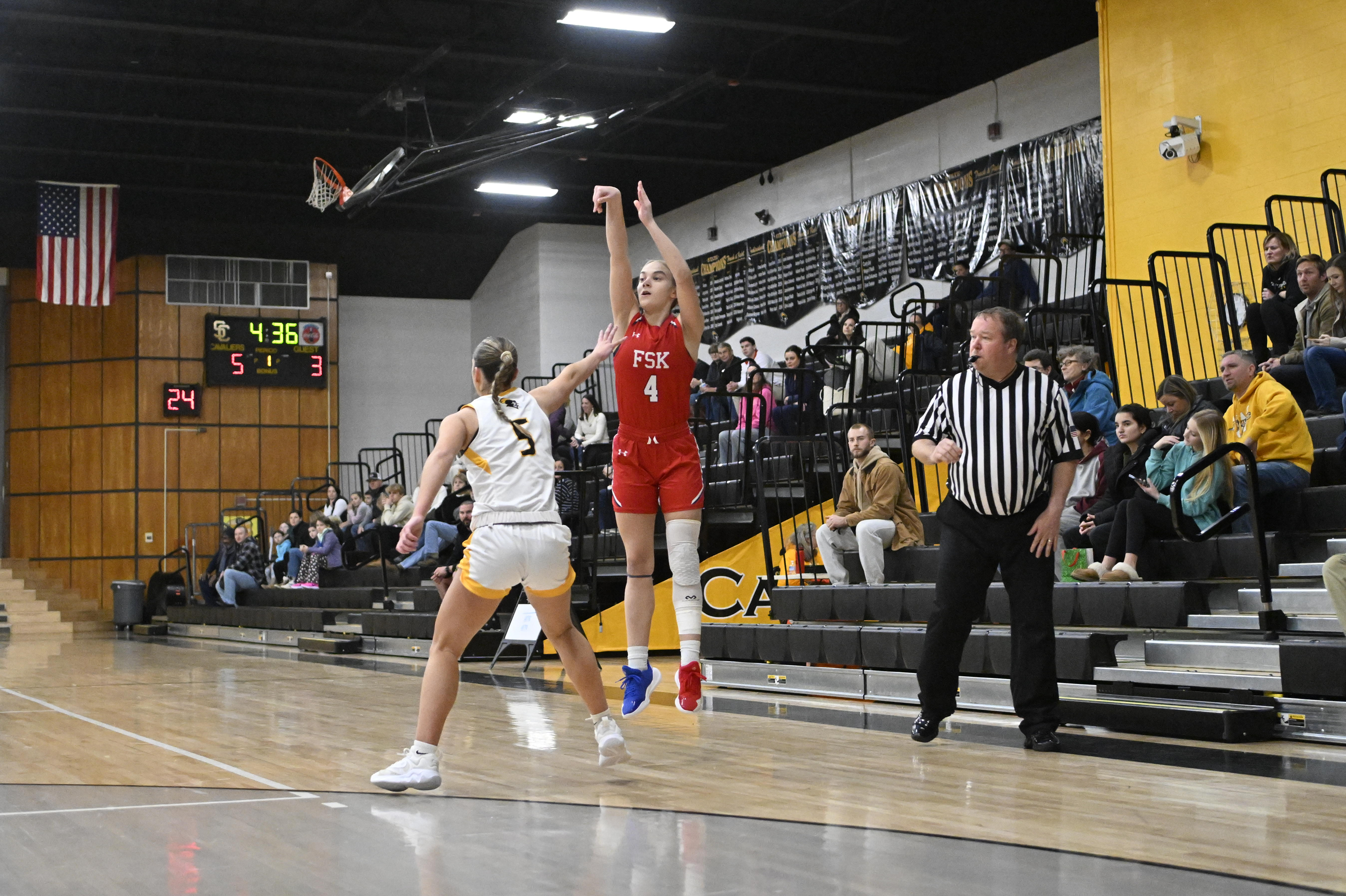 Summer Brooks shoots for three over Leah Miller during a...