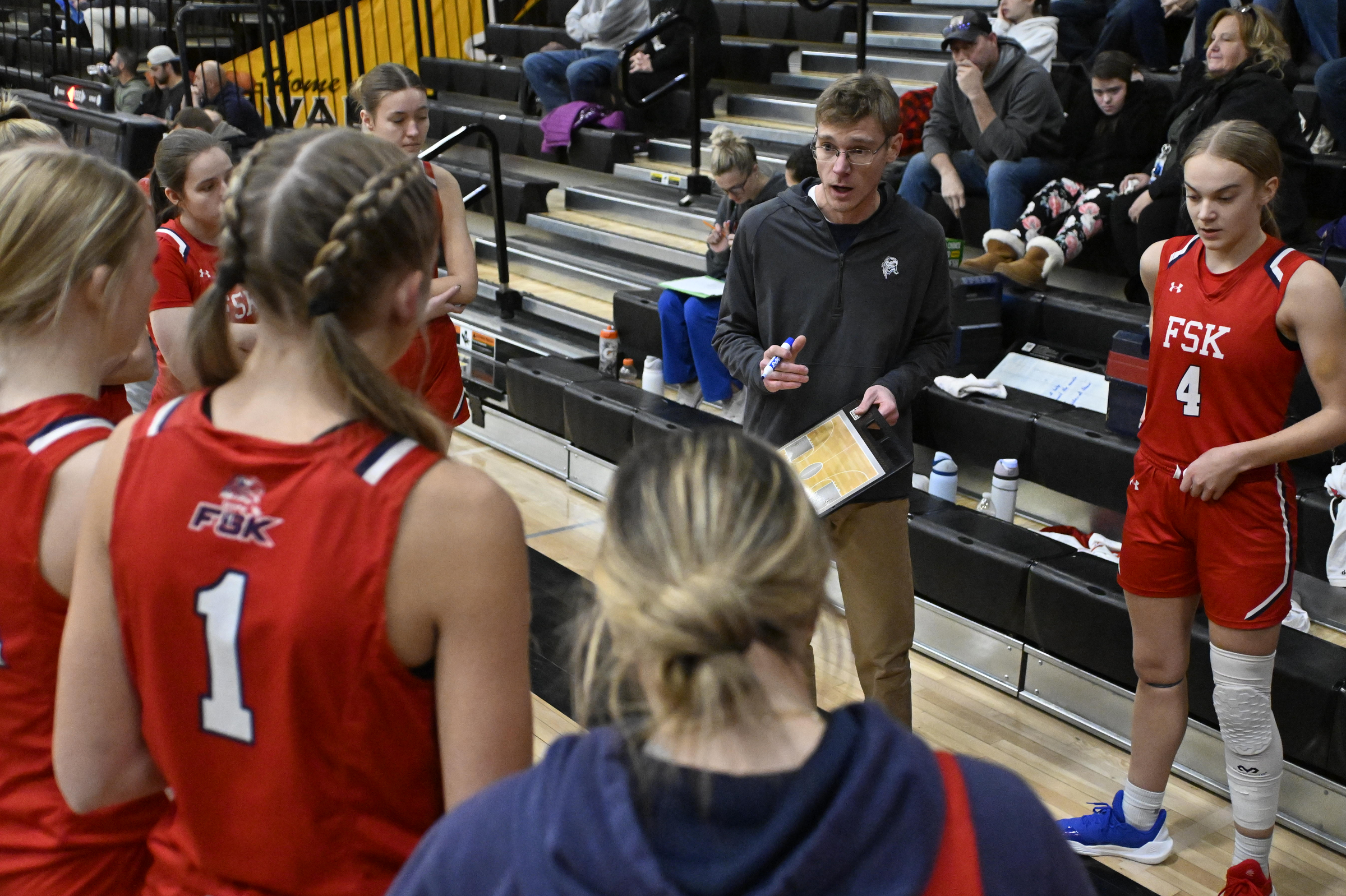 Francis Scott Key coach Mitchell Walther speaks to his team...