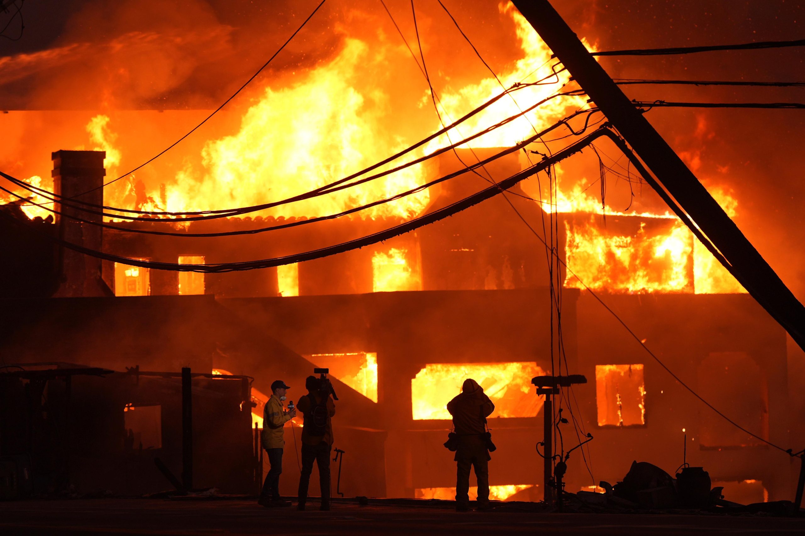 Beach front homes are destroyed by the Palisades Fire Wednesday,...