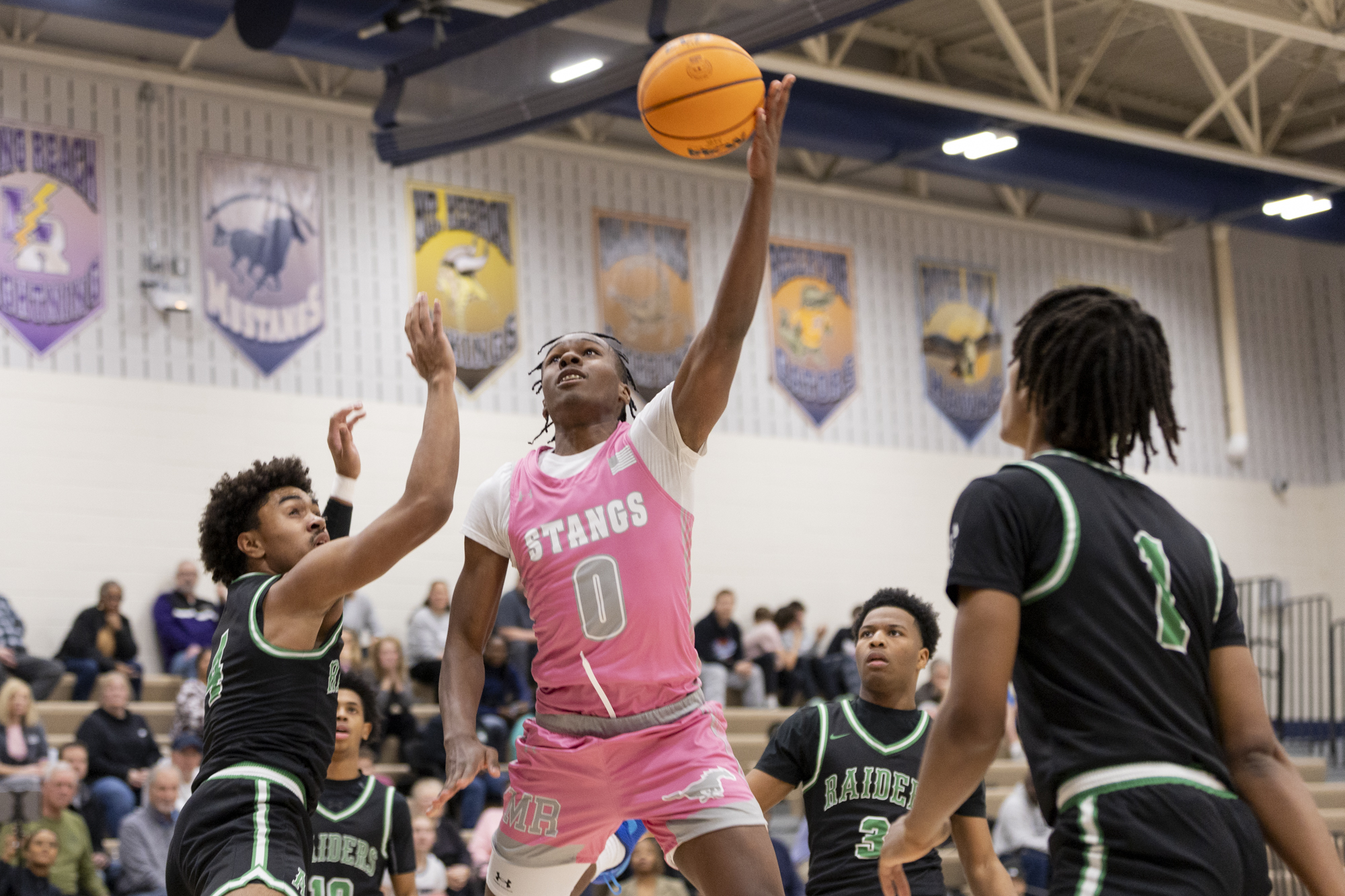 Marriotts Ridge's Rest Whitaker floats around the Atholton defense for...