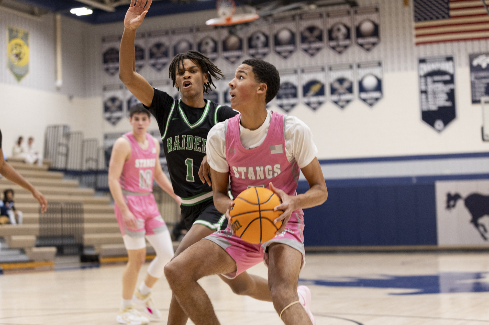 Aaron Hammann drives into the paint against Atholton’s Isaiah Johnson...