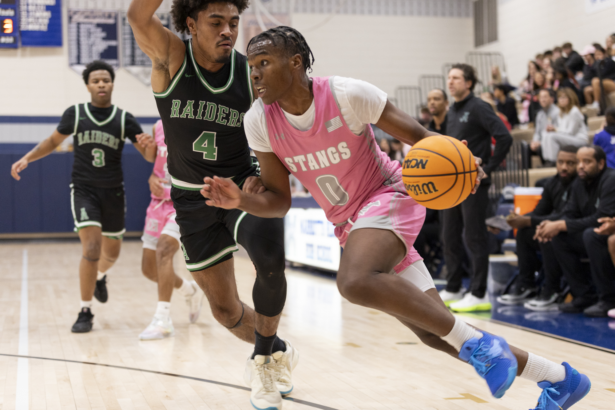 Rest Whitaker drives the baseline against Bryce Inabinet during the...