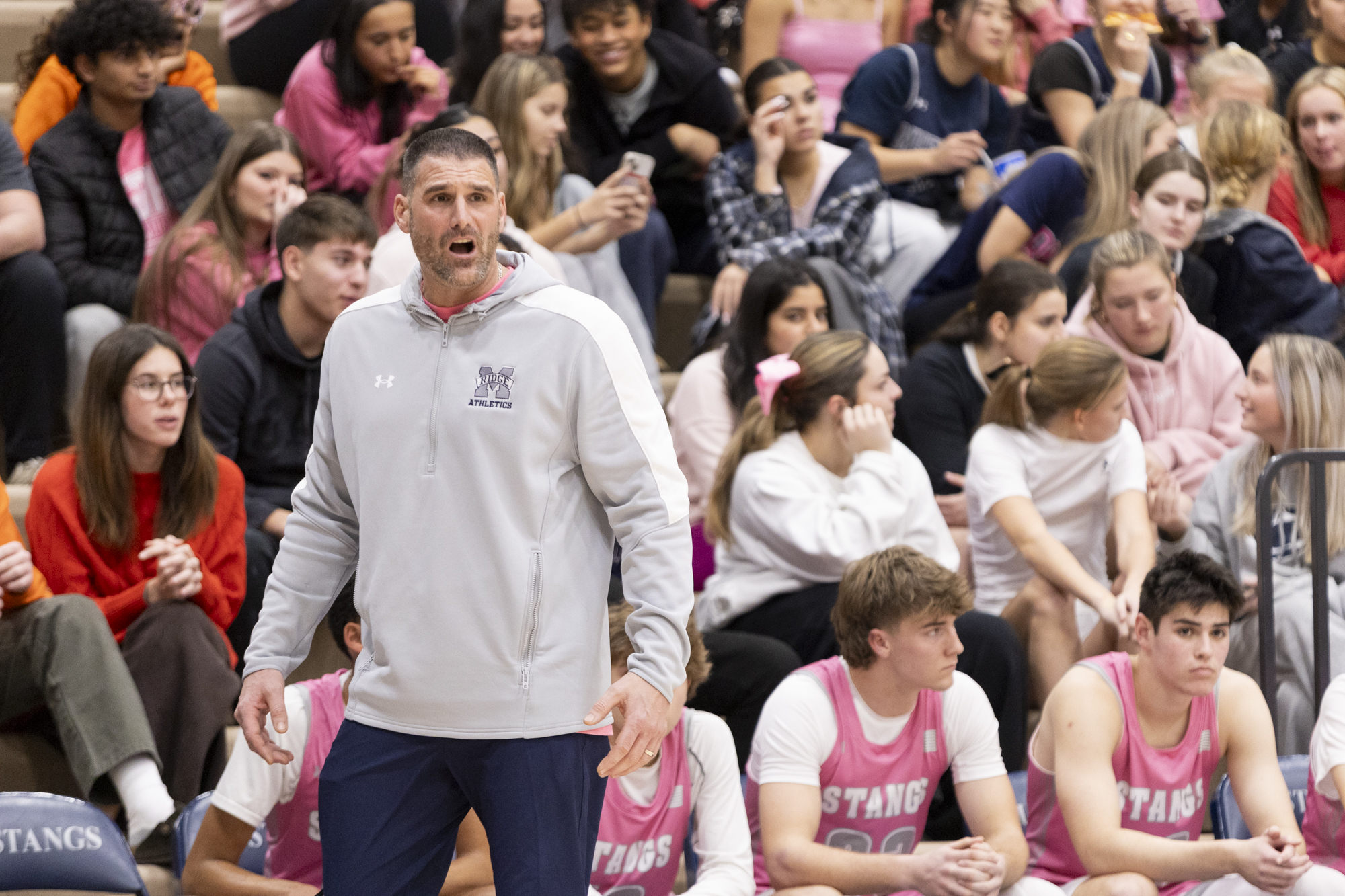 Marriotts Ridge Head Coach Seth Willingham instructs his team during...