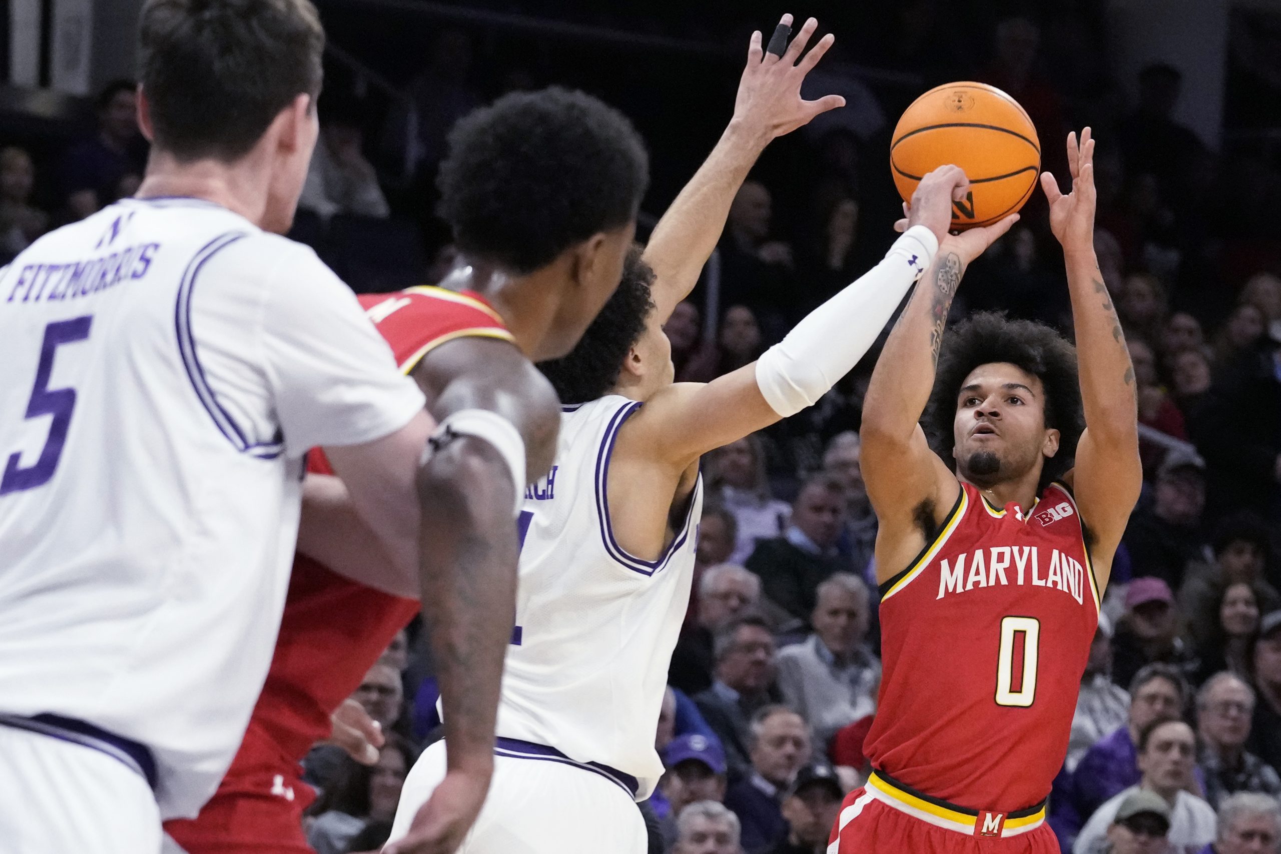 Maryland guard Ja'Kobi Gillespie, right, shoots against Northwestern guard Jalen...