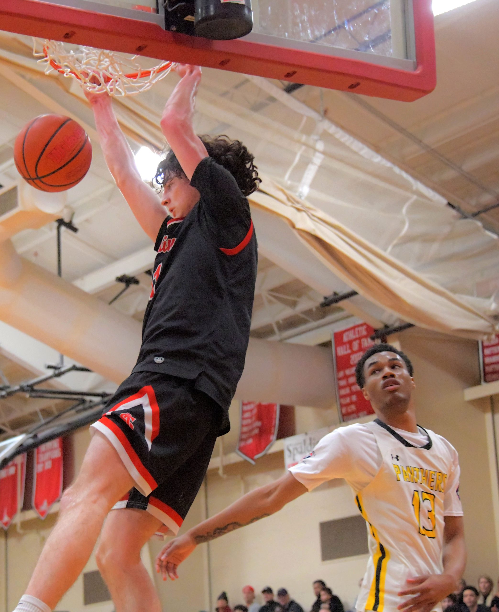 Archbishop Spalding Cavaliers forward Braxton Bogard throws down a slam...