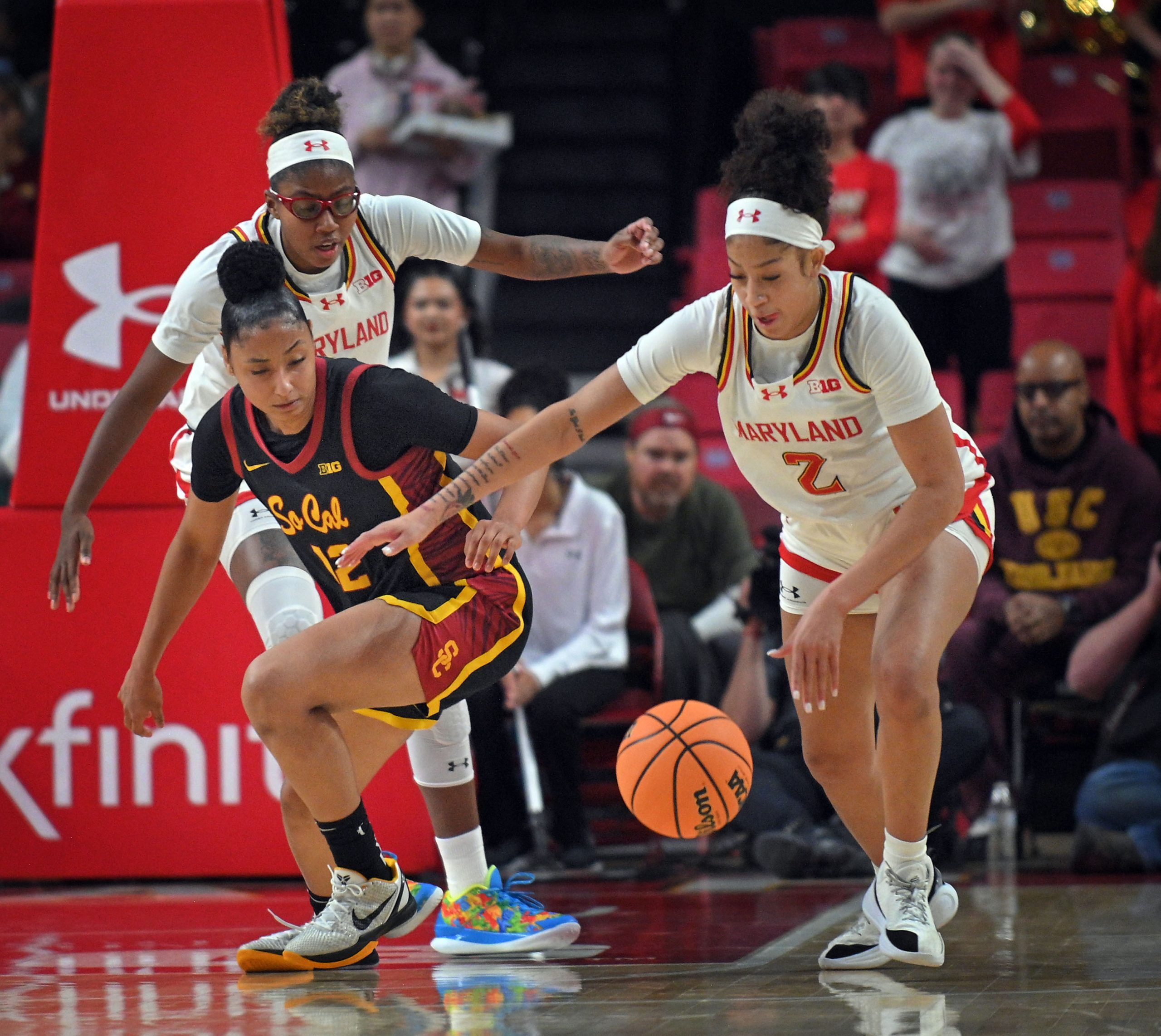 Maryland’s Kaylene Smikle, right, steals the ball from USC’s JuJu...