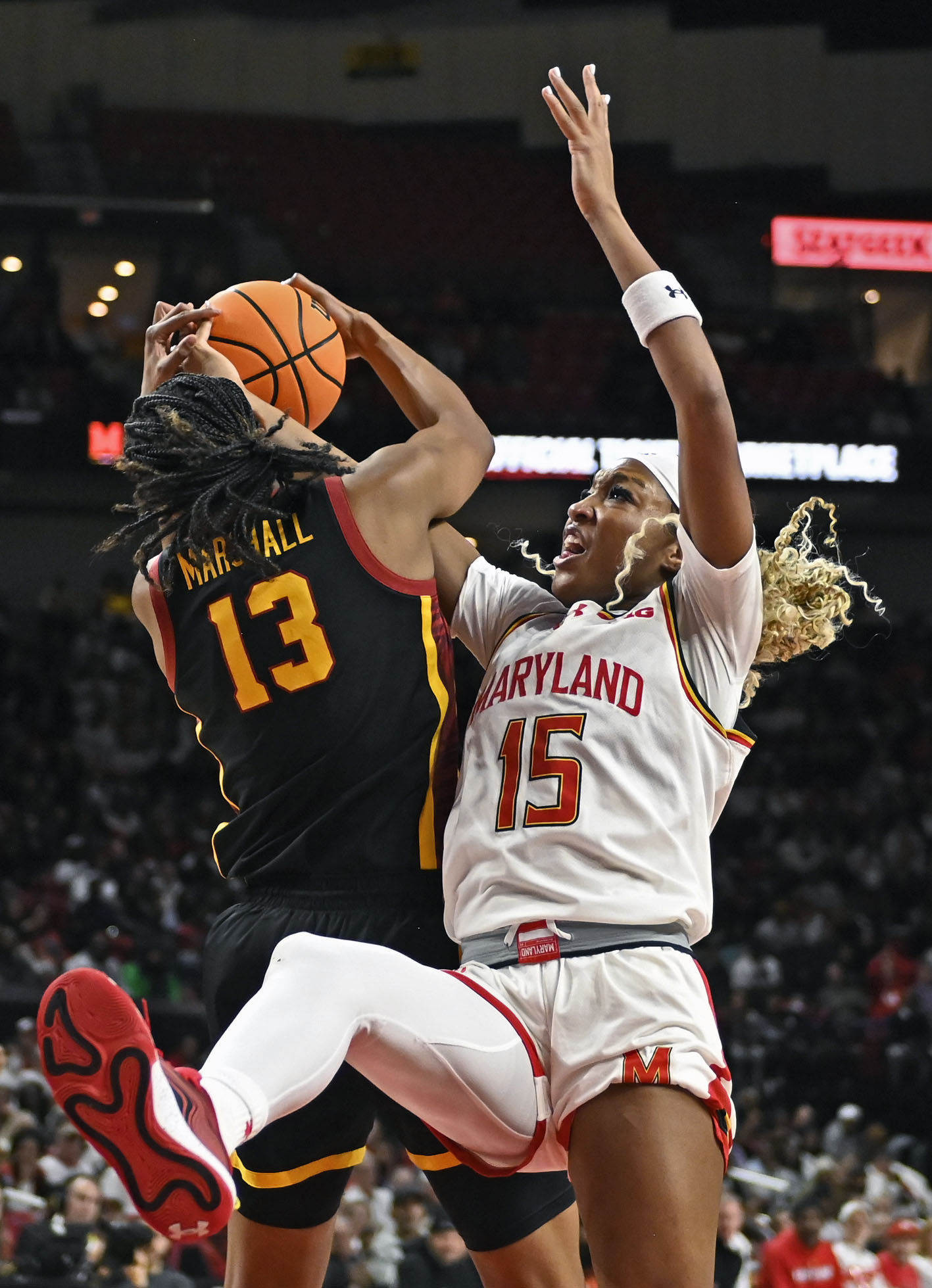 Maryland’s Christina Dalce, right, fights for a rebound against USC’s...