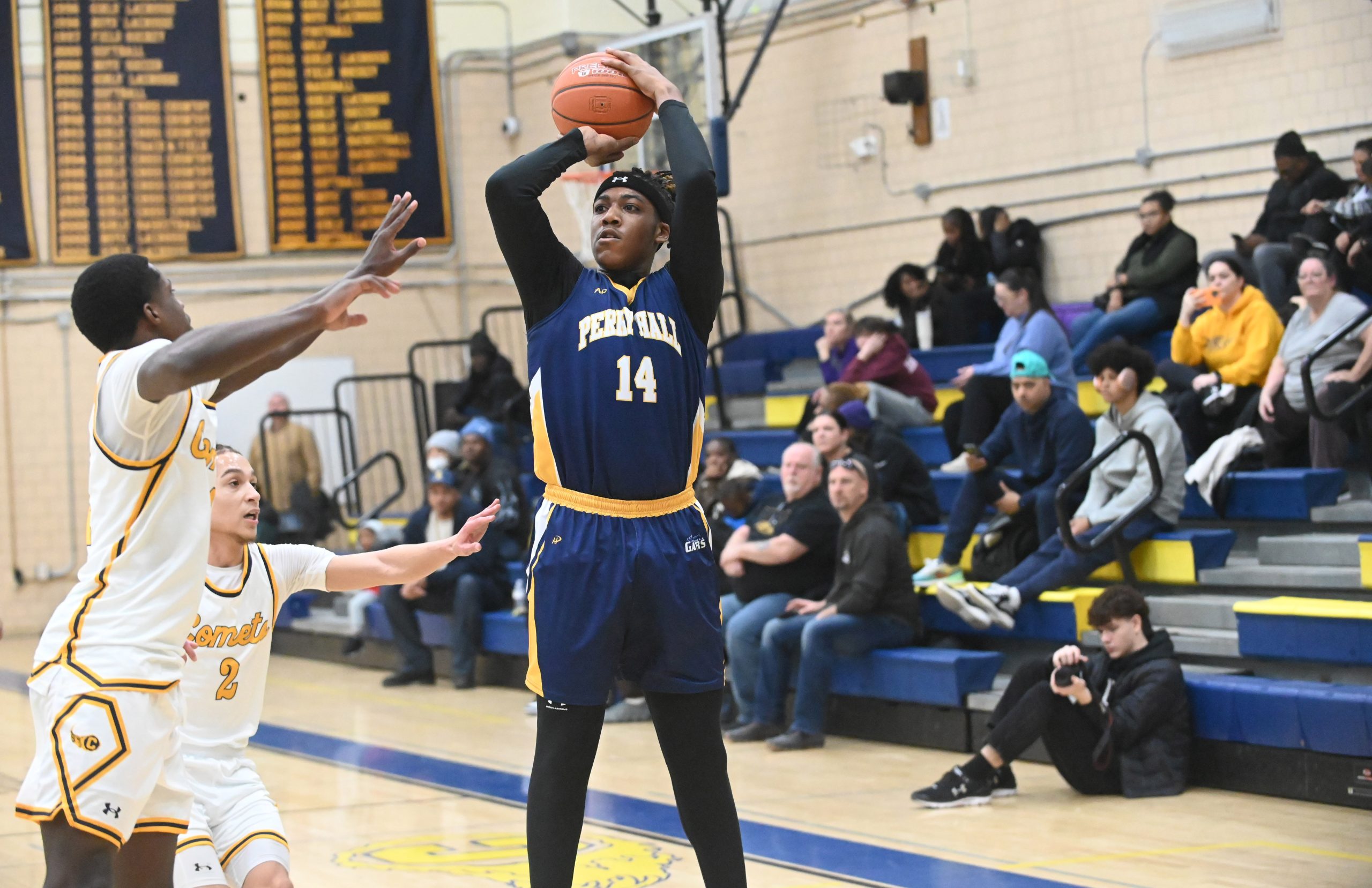 Perry Hall's Ethan Harris-Robinson takes aim at the hoop over...