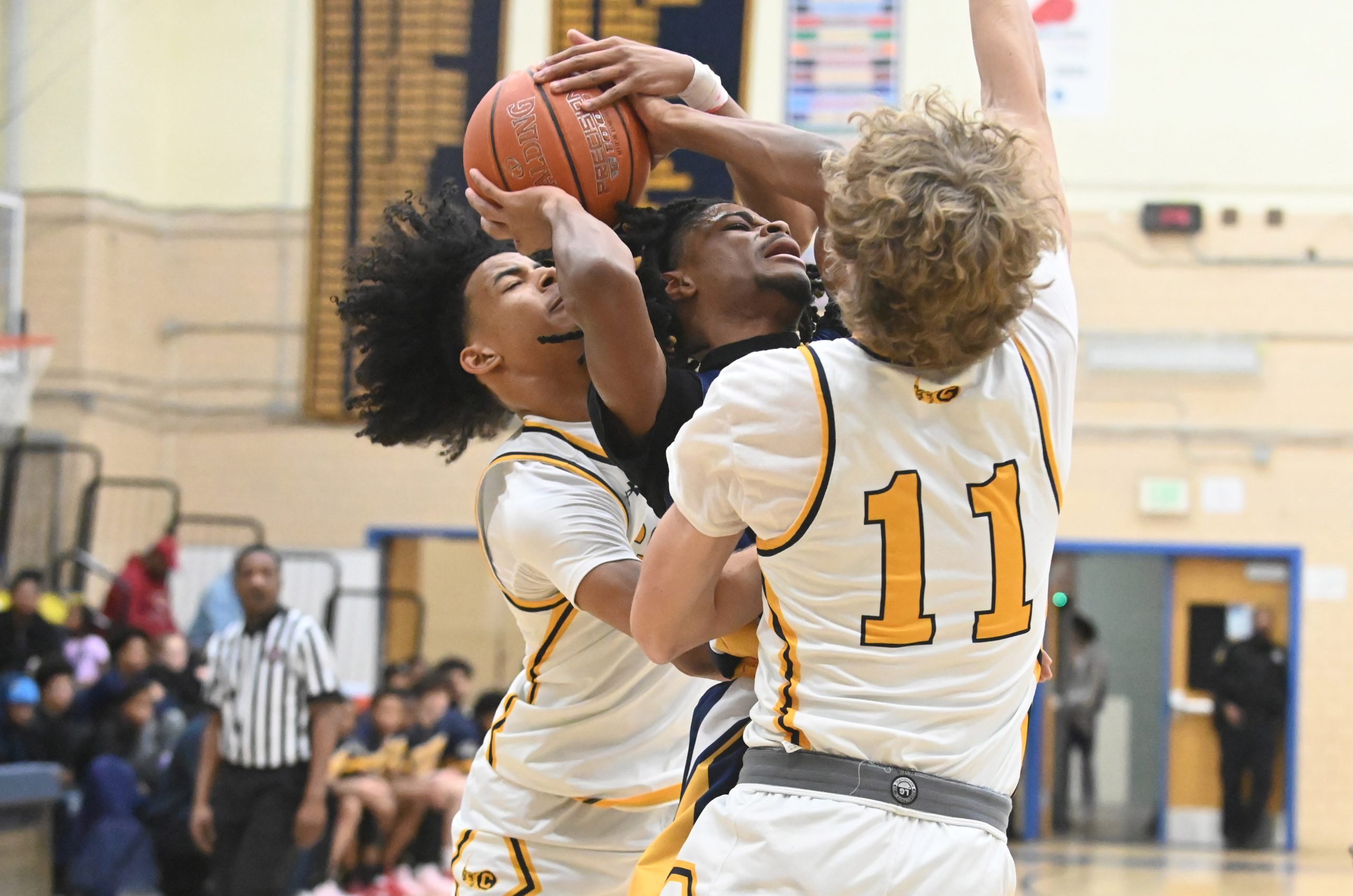 Perry Hall's Alexander Rice, center, can't get a shot off...