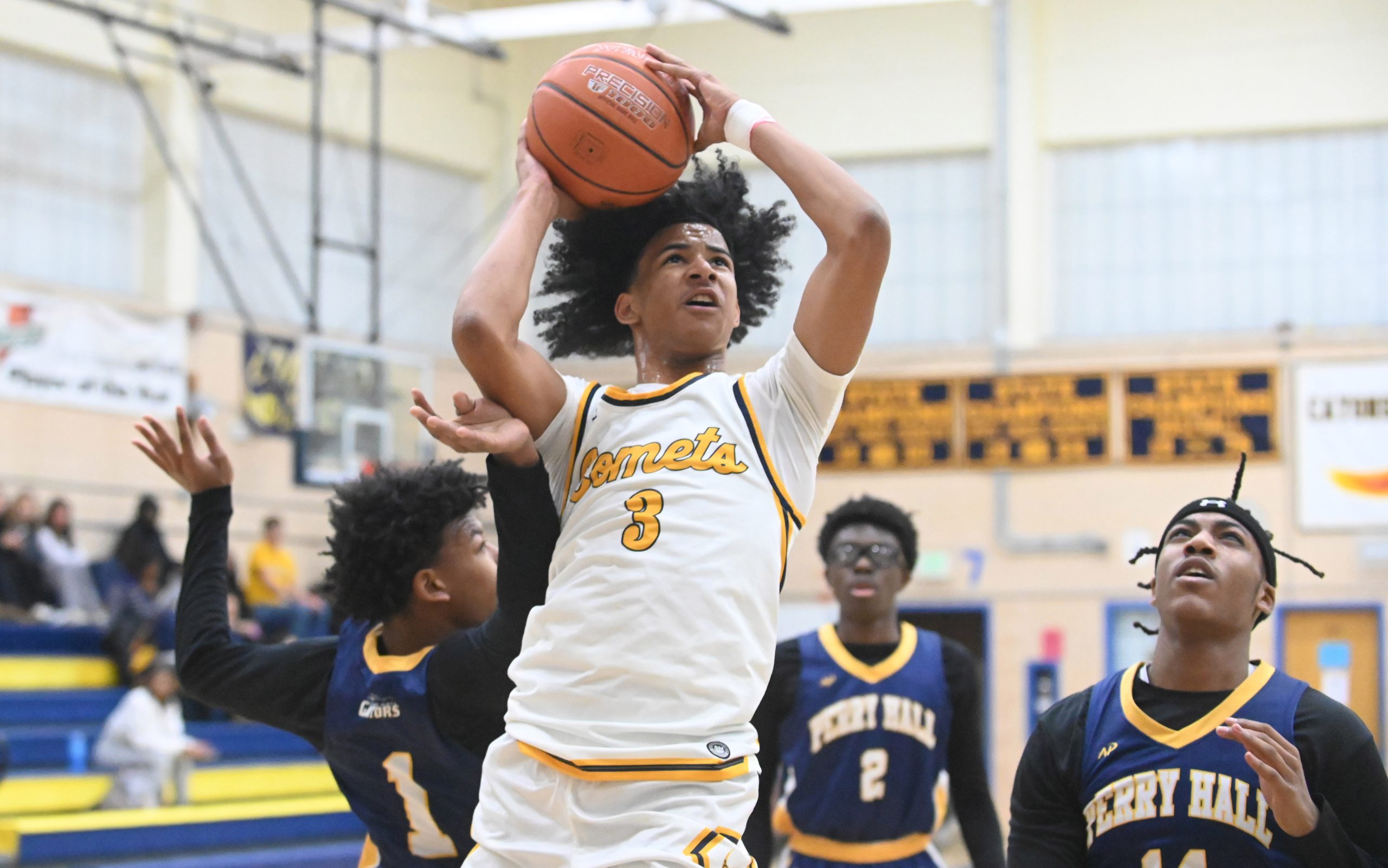 Catonsville's Gavin Edwards puts up a shot after getting past...