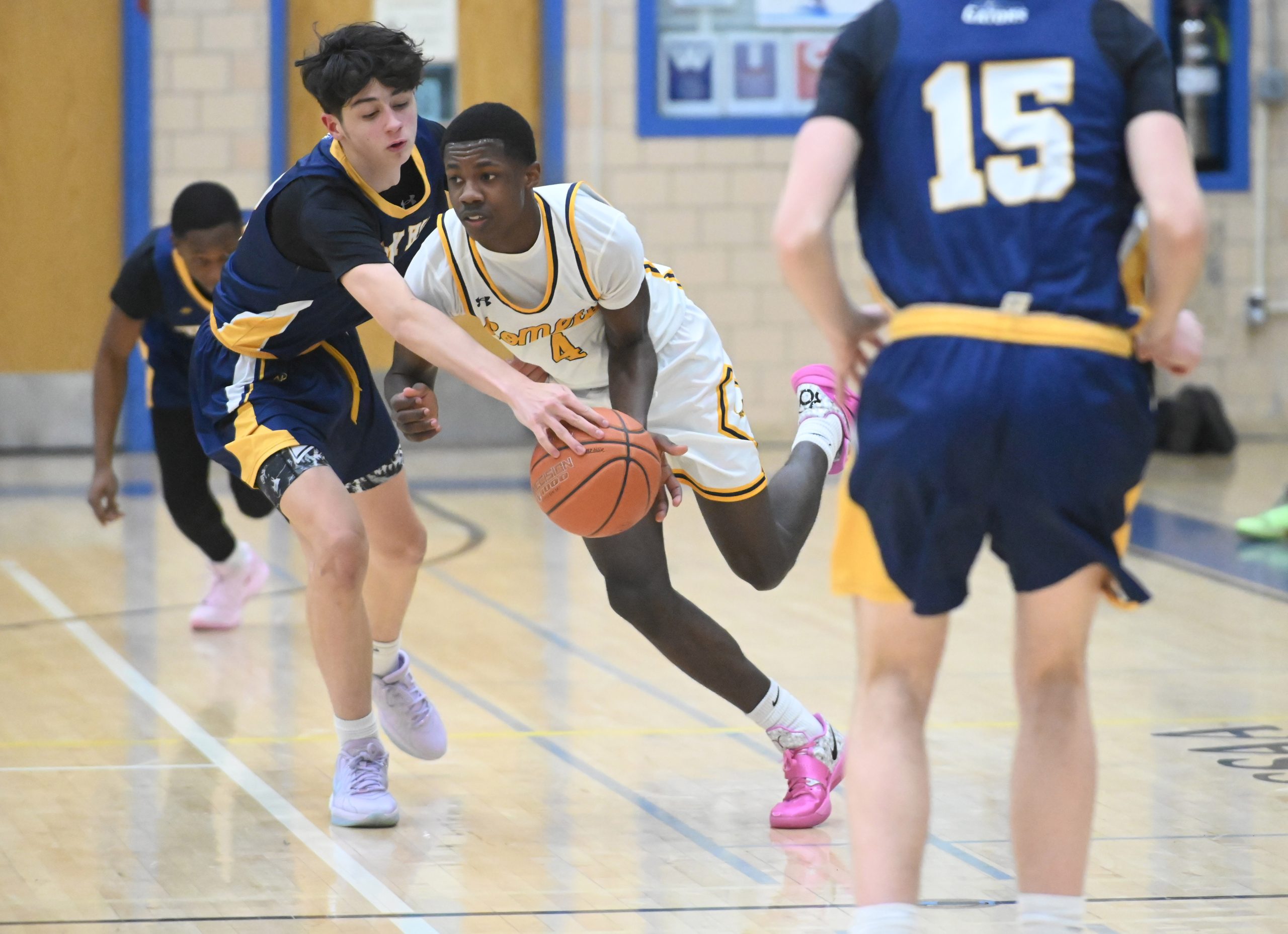 Perry Hall's Jayden Beaton, left, tries to steal the ball...