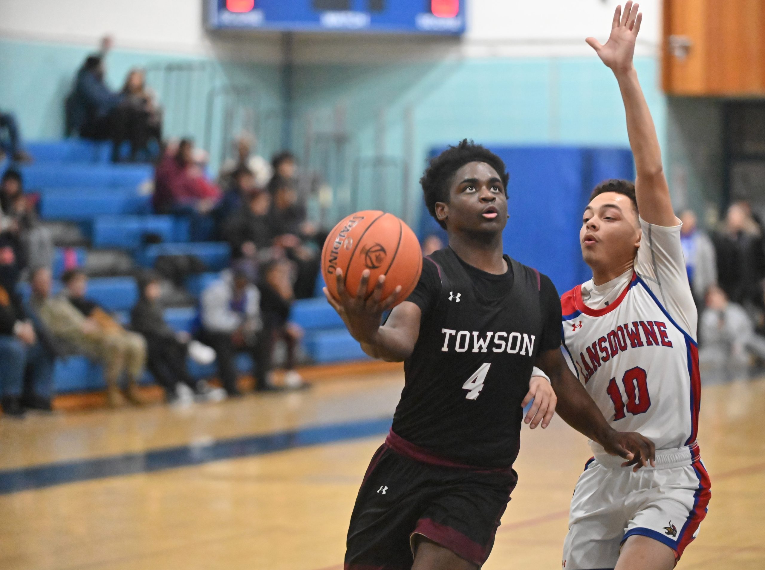 Towson's Devaughn West, left, tries to get past Lansdowne's Jordon...