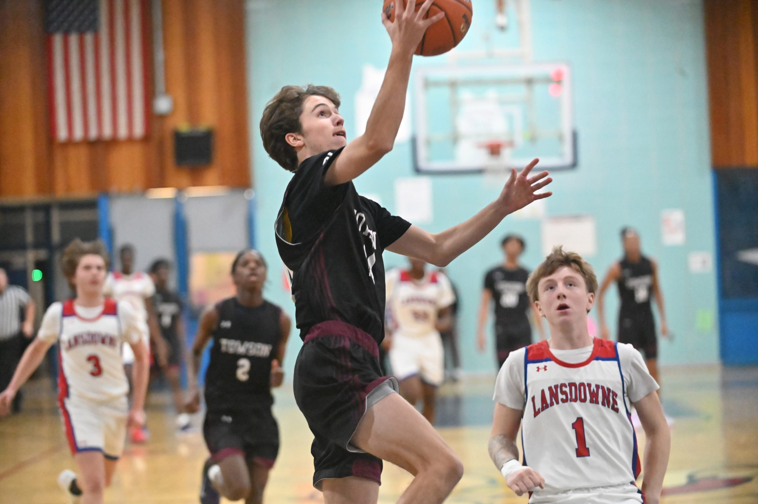 Towson's Patrick Lovas puts up a shot against Lansdowne during...