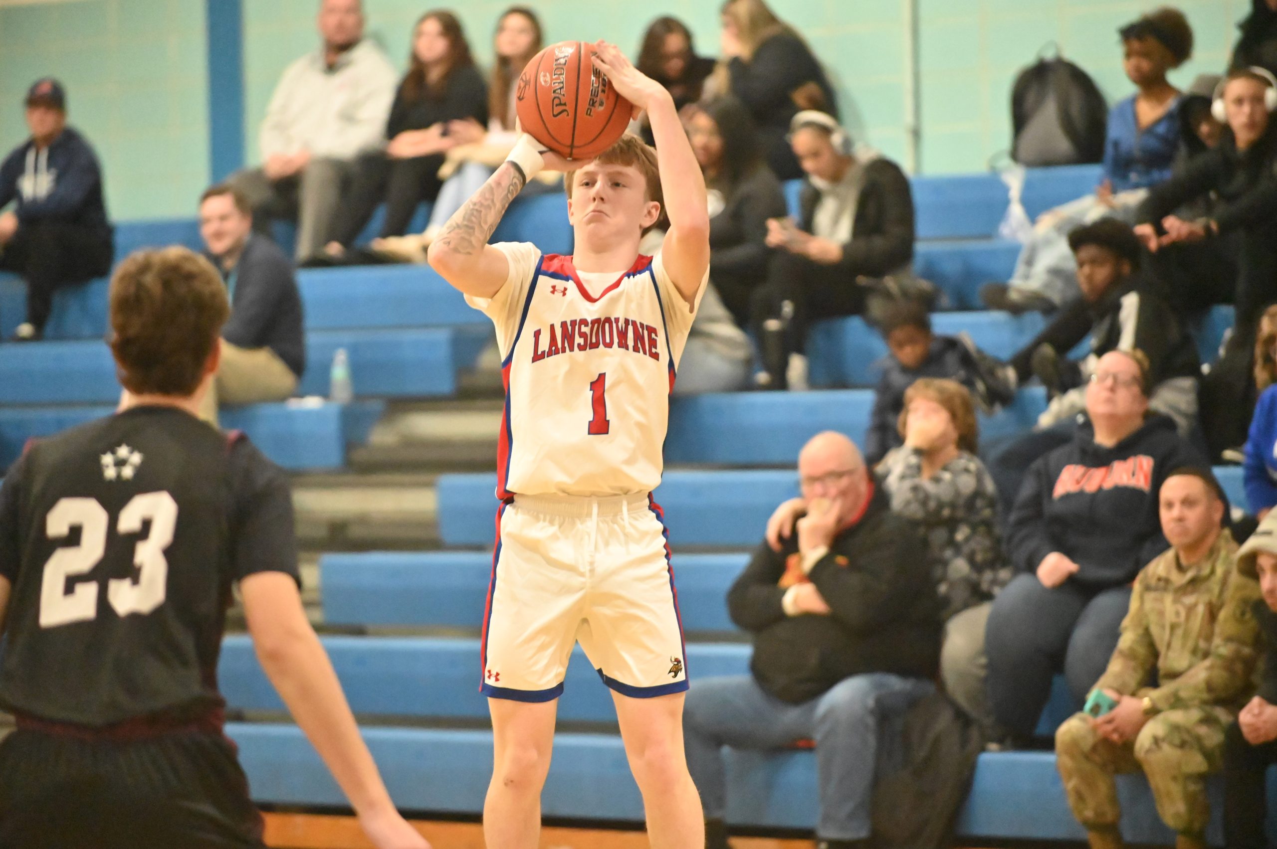 Lansdowne's Ryan Kehoe takes aim at 3-point shot against Towson...