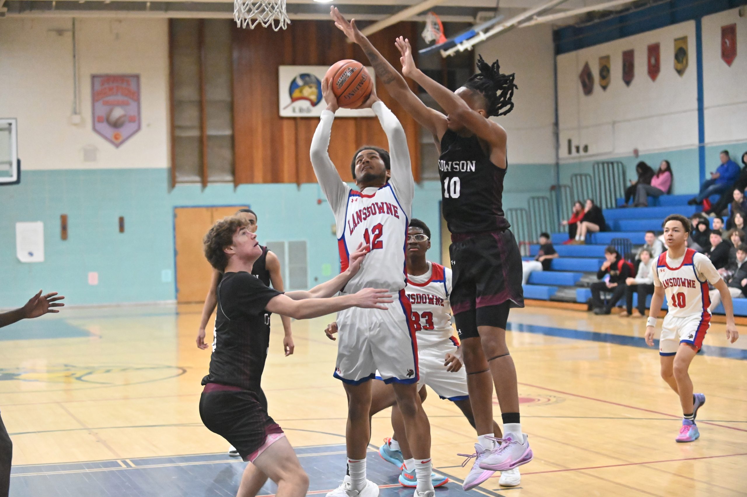 Lansdowne's Topaz Norris has a shot attempt blocked by Towson's...